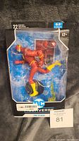 Boxed DC Universe The Flash action figure in original unopened packaging showing figure's dynamic running pose and age recommendation.