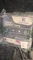 Photo of Pajaso Design Fence Privacy Tape product packaging showing lot contents and design.