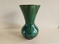 Image showing full vase profile with green glaze, bulbous midsection, and flared top