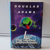 Front cover of the book with title Life, The Universe And Everything by Douglas Adams.