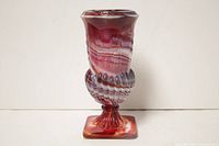 Full view of the marbled slag glass vase showing its overall shape and colors, plus the square base and ribbed stem.