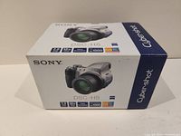 Photo of the original Sony Cyber-shot DSC-H5 camera box featuring product image and highlighted specs such as 7.2 megapixels, 12x optical zoom, Super SteadyShot, and high sensitivity ISO 1000.