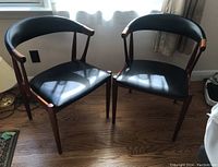 Angled front view of both chairs showing overall design and finish