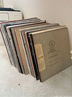 Side view showing the collection of approximately 50 LP records with visible album covers, dominated by classical music titles.