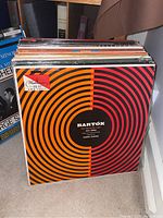 Front view of a stack of classical music LP albums showing an orange and red Bartók album cover with circular design