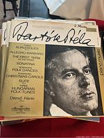 LP record cover of Dezsö Ránki playing Bartók Béla pieces featuring a black and white portrait and gold text detailing the works on the piano album cover.