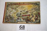 Front cover full-color illustrated with cartoon cityscape and titled 'Barker's Komic Picture Souvenir'