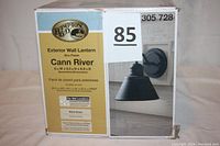 Box of Hampton Bay Cann River 9.5 Inch Exterior Wall Lantern Sconce showing product and branding details