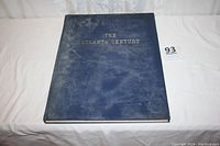 Blue cloth hardcover book with gold embossed title 'The Atlanta Century' on front cover.