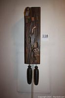 Front view of entire clock hanging on wall