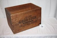 Overall angled view of wooden crate showing markings and condition