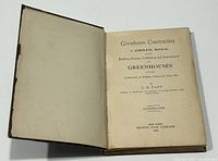 Photo of the open title page of the 1893 hardcover book showing the title 'Greenhouse Construction' by L.R. Taft, publisher Orange Judd Company, New York, 1893.