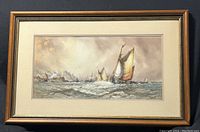 Framed watercolour painting depicting sailing boats on a choppy sea, signed by William Stewart.