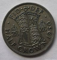Reverse side of the 1950 British Half Crown showing the detailed royal coat of arms with inscriptions: FID DEF HALF CROWN 1950.