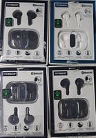 Front view of four Fisher true wireless earbud sets in original packaging showing two black sets and two white sets. Packaging is worn from storage.