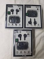 Three packages of Fisher Digital Sound True Wireless Ear Buds, sealed in original boxes, showing front with earbuds and charging case image.