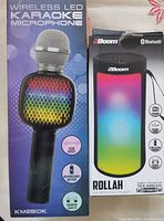 Photo showing packaging of wireless LED karaoke microphone KM250K with colorful LED lights and echo effect, rechargeable battery.