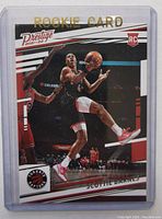 Front of the Scottie Barnes rookie card showing player in action for Toronto Raptors with Rookie Card and RC logos.