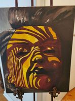 Front view of the acrylic abstract portrait painting with close-up of face and lighting/shadow effects.