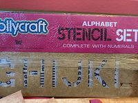 Close-up of Jollycraft Alphabet Stencil Set box with letters and numerals