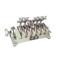 Vintage Moviola 8-gang 16mm film synchronizer showing front and side profile with metallic bodies, film slot mechanisms, and mechanical counter.