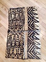 Tapa cloth with tan background and black geometric tribal motifs