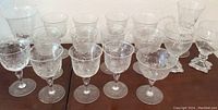Full set of vintage stemware glasses including etched crystal and glass stems.