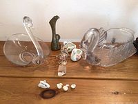 Full view of all swan-themed items on wooden surface