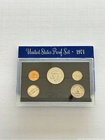 Front of the 1971 United States Proof Set displaying five coins in protective plastic with blue labeled cover.