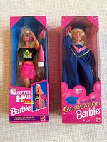 Front view of Glitter Hair Barbie in black top and pink skirt in original box with glitter gel and hair styling tool visible.