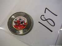 Obverse side showing the colored inset of the hockey players and Summit Series 50 years logo.