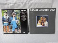 Front and back covers of ABBA Greatest Hits Volumes I & II.