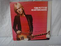 Front cover of the vinyl album showing Tom Petty holding a guitar