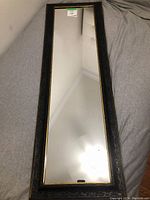 Overall full length mirror showing entire reflective surface and frame.