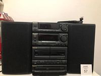 Front view of Panasonic stereo system with main unit and two speakers