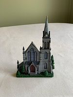 Front view of miniature model of Trinity Church showing architecture and landscaping details