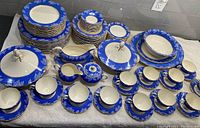 Full array of all place settings and serving pieces laid out