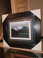 Overall view of the professionally framed Lawren Harris print with protective corners on frame.