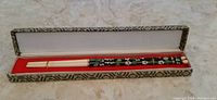 Vintage cloisonné chopsticks set inside decorative box, showing entire length and presentation case.