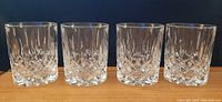 Set of 4 Riedel double old fashioned glasses displayed in a row, showing their size and uniform cut crystal design.