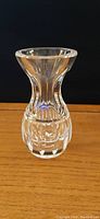 Small Waterford crystal vase showing side view with flared mouth and detailed cuts