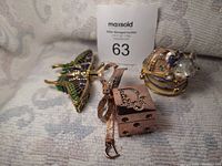 Three items: butterfly trinket box, Dior lip gloss, mouse crystal cup trinket box