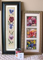 Photo showing two tall framed floral art pieces side by side with a Campbell's soup can for scale