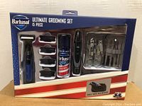 Front view of the sealed Barbasol 15 piece grooming kit in original retail packaging with all items visible through window.