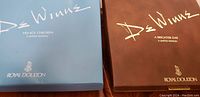 Two box lids showing Dez Winik series titles and Royal Doulton branding.