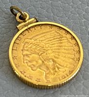 Obverse side of pendant showing Indian Head profile, LIBERTY, stars, date 1914