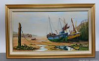 Framed oil painting on canvas depicting two boats anchored on a beach with a post and rope in the foreground.