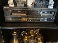 Full front view of the Technics stereo double cassette deck showing both cassette compartments and control buttons.