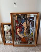 Side angle view of both JOB Cigarettes and Coca-Cola mirrors showing wood frames