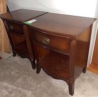 Front view of both nightstands showing overall condition, finish, drawer front and shelf